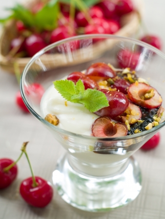 Yoghurt dessert with cherry, selective focusの写真素材