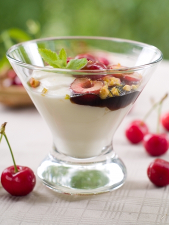 Yoghurt dessert with cherry, selective focusの写真素材