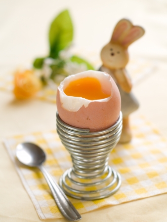 Soft boiled egg with easter decorationの写真素材