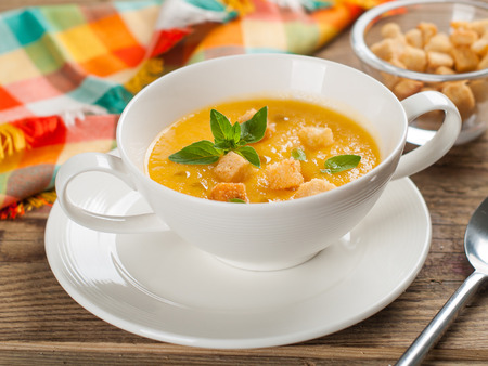 Bowl of pumpkin cream soup,selective focusの写真素材