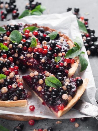 Fresh berries tart with mint, selective focusの写真素材
