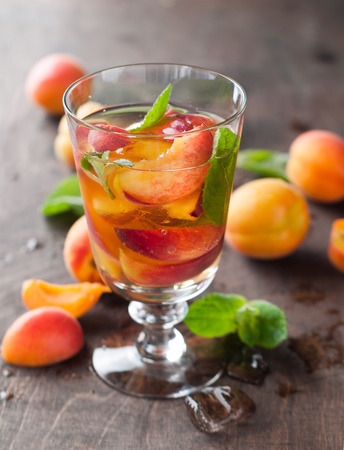 Summer drink with apricot ( or peach)  in glass, selective focusの写真素材