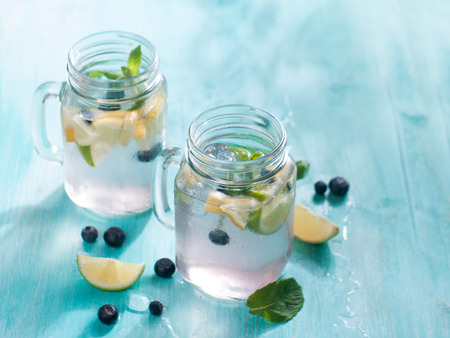 Citrus lemonade with blueberry and mint, selective focusの写真素材