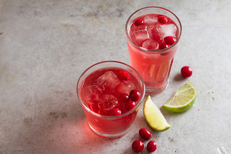 Drink with cranberry in glasses on the vintage table, selective focusの写真素材