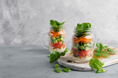 Healthy homemade mason jar salad with chicken and vegetables - healthy food, diet, detox concept, selective focusの写真素材
