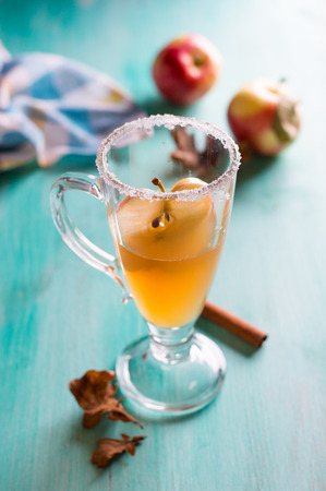 Apple cider or fruit tea in glass cup, selective focusの写真素材