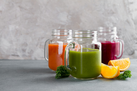 Fresh fruit and vegetable juice in the glass maison jar for detox or healthy lifestyle, selective focusの写真素材