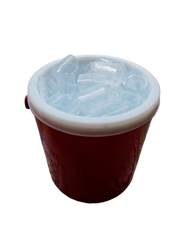 Ice bucket filled with ice cubes isolate on white backgroundの写真素材
