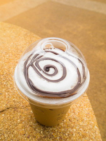 ice coffee,Cold milk coffee and ice in glass,Iced coffee latte in plastic cupの写真素材