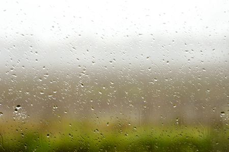 Misty window on a rainy day in november