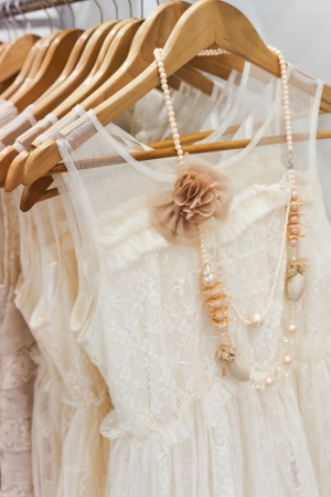 A picture of beautiful lace white dress on the hanger  の写真素材