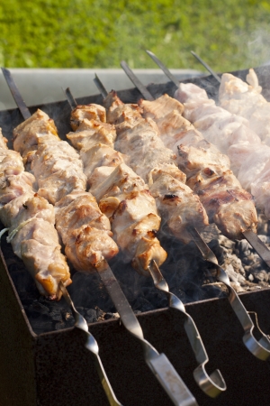 Picture of meat cooking on barbeque grillの写真素材