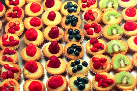 Selection of beautiful fruit mini cakes.の写真素材