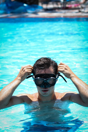 Picture of a young man in a snorkelling maskの写真素材