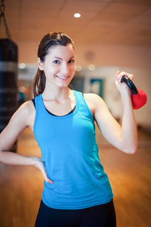 Photo of a girl working out in the gym.の写真素材