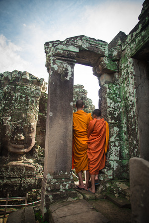 Two monks in Bayon Temple in Angkor Wat, Cambodiaの写真素材