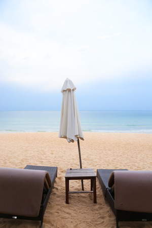 Two sunbeds on the beach in Thailandの写真素材