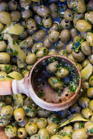 Delicious green olives on the marketの写真素材