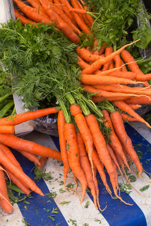 Delicious bright carrots on the marketの写真素材