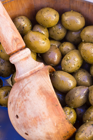 Delicious green olives on the marketの写真素材