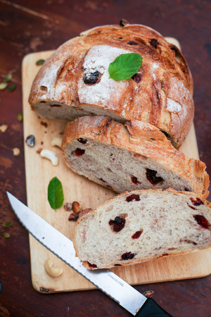 Cranberry and walnut bread and red wineの写真素材