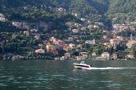 Motorboat on the beautiful lake landscape on lake Comoの写真素材