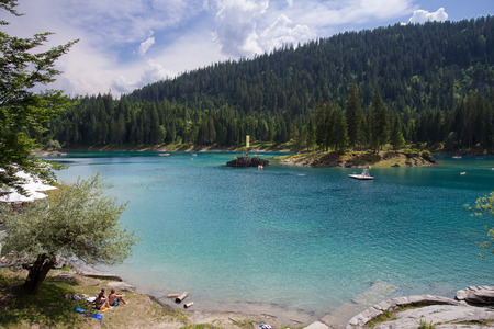 People relaxing at the lake Cauma in Switzerlandの写真素材