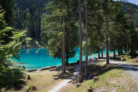 Group of people relazing at the lake Cauma in Switzerlandの写真素材