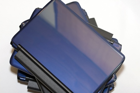 Bunch of netbook computers isolated on white.の写真素材