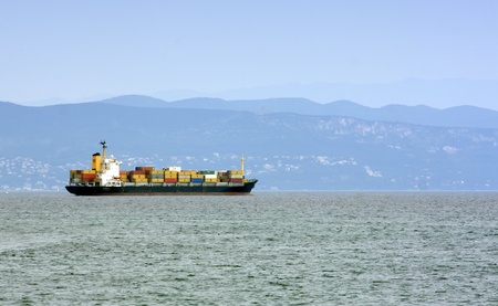 Cargo ship by the shore.