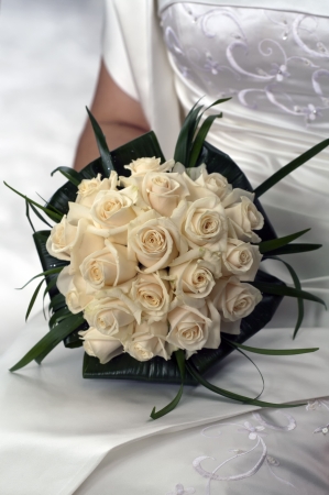 Bride detail with boquet from white roses.の写真素材