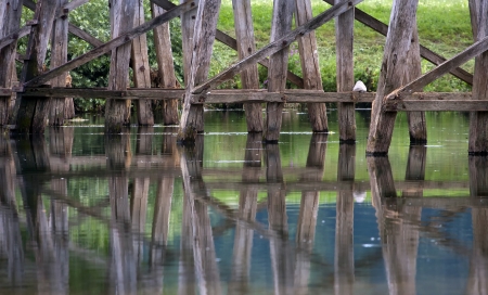 Detailof the old wooden bridge with reflections.の写真素材