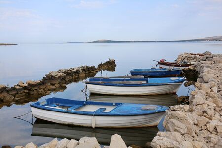 Small fishing boats docked in the island of Pag, Croatia.の写真素材