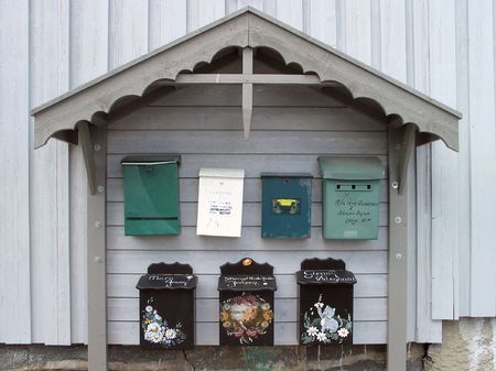 seven different mailboxes under one roofの写真素材