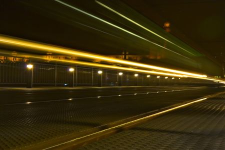 lines of lights after train that left at nighttimeの写真素材