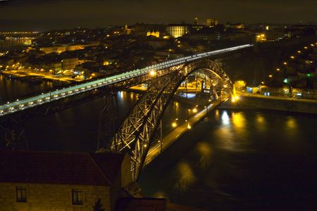modern bridge with a lot of lights at nighttime