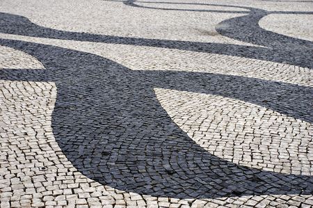 black pattern on white pavement