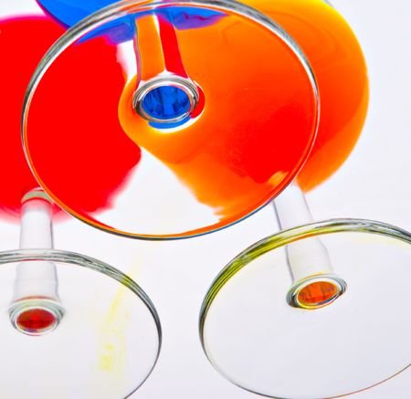 Bottom of three glasses with color drinksの写真素材