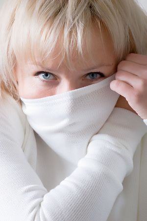 portrait of the beautiful blond girl with blue eyesの写真素材