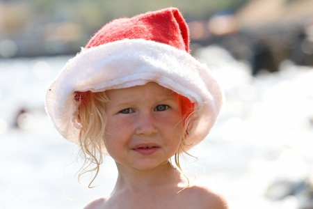 cute  with santa claus red hat on sea backgroundの写真素材