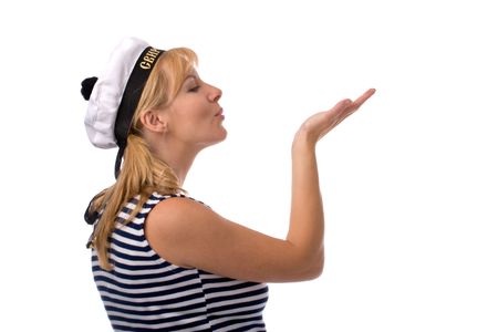 beautiful woman in russian sailor clothes blowing on her palm with good luck wish, isolated on whiteの写真素材