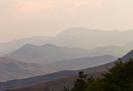 blue hills landscape with several rows of mountain ridgesの写真素材