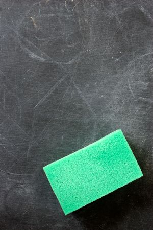 close-up of blackboard with cleaning sponge on itの写真素材