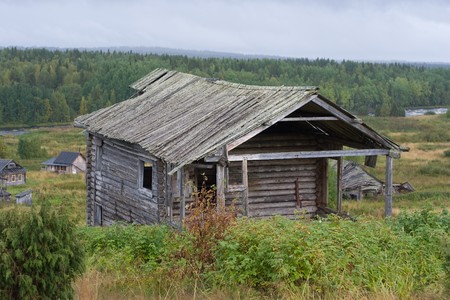 old wooden abandoned house in forest villageの写真素材