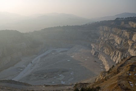 top view on  sandy open-cast mine tightened by cloudsの写真素材