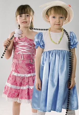 two trendy little girls, isolated on whiteの写真素材