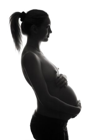 beautiful pregnant woman silhouette, isolated on white backgroundの写真素材