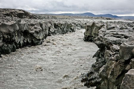 Iceland mountain river with stony banksの写真素材