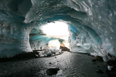 ice arch in blue glacier in Icelandの写真素材