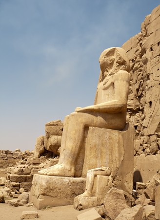big sitting Egyptian statue in Karnak Temple, Luxor, Egyptの写真素材